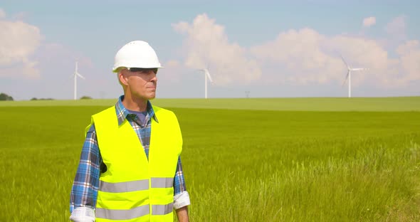 Engineer Using Digital Tablet at Windmill Farm