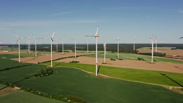 A Drone Shot of a Massive Wind Farm in Agricultural Land