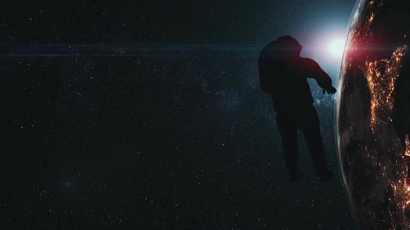 Astronaut Man Silhouette Against Realistic Earth alt