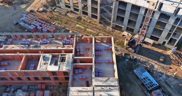 High Rise Building Under Construction in Assembling the Frame From Cement Blocks