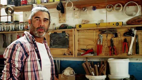 Attractive carpenter smiling for camera