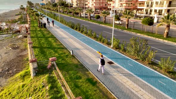 People walk around the embankment