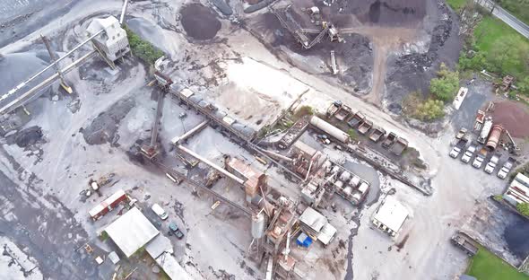 Open-pit iron ore mining, a big mining truck at work, working in a quarry