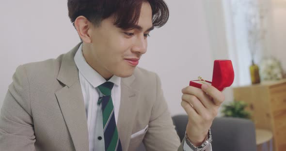 Slow Motion Handsome Asian Groom Opening A Red Ring Box And Looking Wedding Ring The Box.