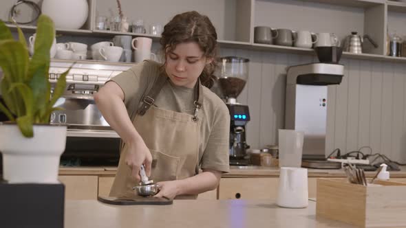 Girl Making Espresso on Coffee Machine