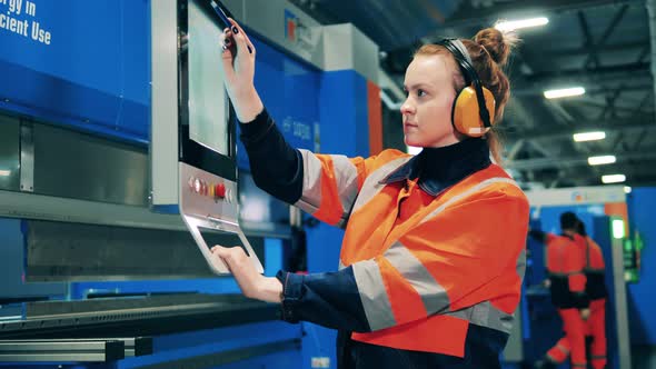 Lady Engineer Is Navigating Display Industrial Machine