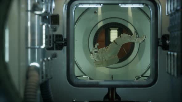 Astronaut Inside the Orbital Space Station