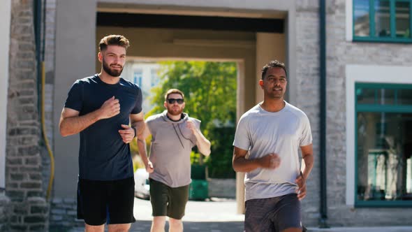 Young Men or Male Friends Running Outdoors