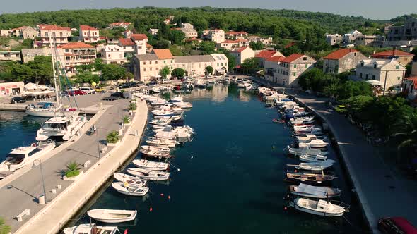 Aerial view of Sumartin harbor with small boats anchored, Brac island, Croatia.