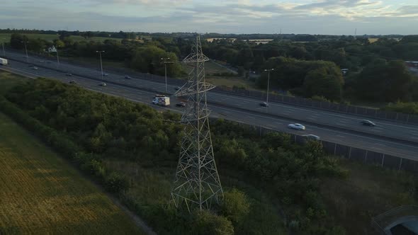 Aerial View of an Electricity Pylon and Motorway