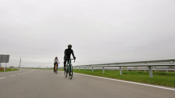 Two Cyclists are Training on the Track