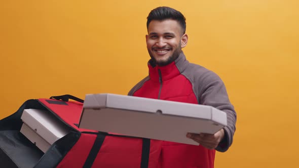 Indian Man Delivering Pizza to the Customer with Smile