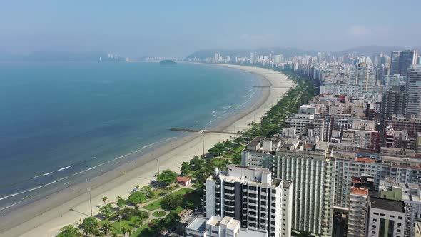 Panning wide landscape of coast city of Santos state of Sao Paulo Brazil.