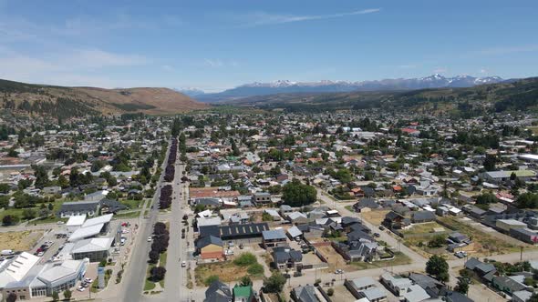 Pan right rising over Esquel valley surrounded by Andean mountains, Patagonia Argentina