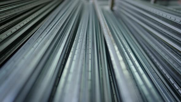 Manufactured Stainless Steel Aluminum Corner Profiles Lying in Warehouse Indoors