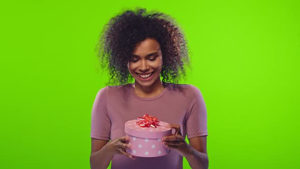 Young Happy African American Woman Disappointed By Gift Received
