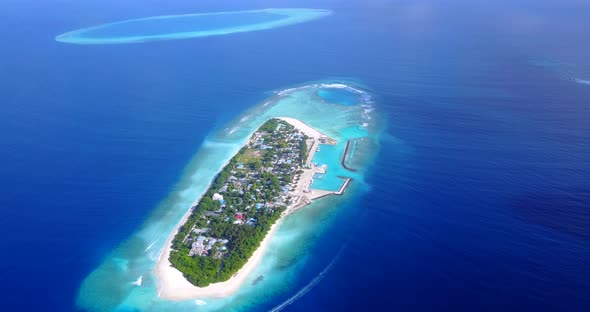 Luxury aerial travel shot of a sunshine white sandy paradise beach and blue sea background