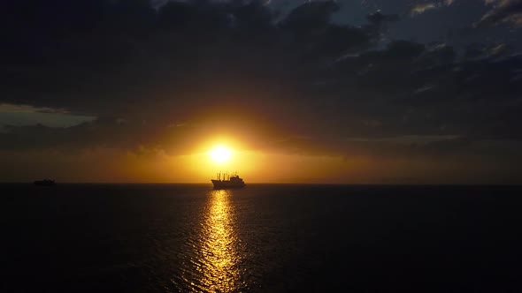 A Drone View of a Ship Anchored at Sea at Sunset in the Amur Bay