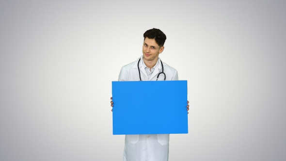 Happy Smiling Male Doctor Showing Blank Signboard and Dancing