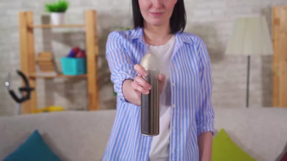 Female Housewife Uses Air Freshener Slow Mo