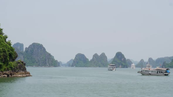 Old passenger ship cruising along Halong Bay