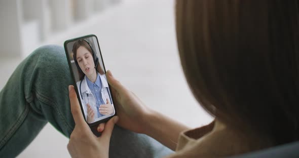 Female Using Online Chat To Talk with Family Therapist and Checks Possible Symptoms During Pandemic