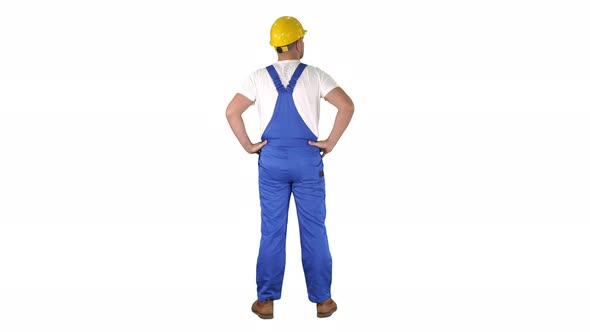 Engineer in Construction Helmet Standing with Hands on Hips Looking Around on White Background