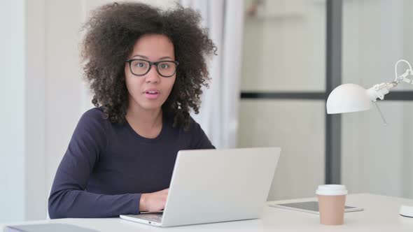 African Woman Feeling Shocked While Using Laptop