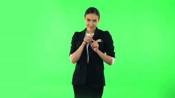 Cute Girl Smiles and Showing Heart with Fingers Then Blowing Kiss, Green Screen