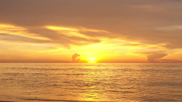 Tropical sea at sunset or sunrise over sea video 4K, The sun touches horizon, Red sky in golden hour