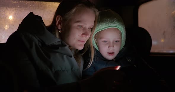 Mom and Daughter in the Car