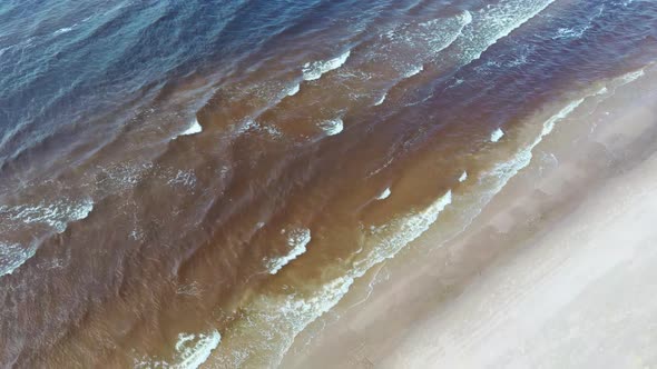  Baltic Sea Costline With Waves View From Above. Sea Waves Over a Sandy Beach. Top View 4K Aerial