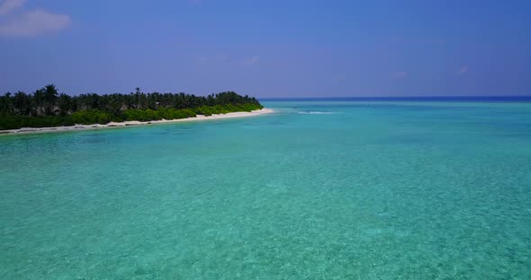 Natural flying island view of a summer white paradise sand beach and blue water background in vibran