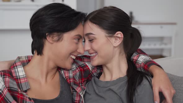 Happy Lesbian Lgbtq Couple Enjoying Bonding Hugging Cuddling and Kissing