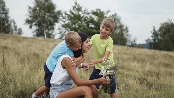 Children play with my mom in the mountains a fun family