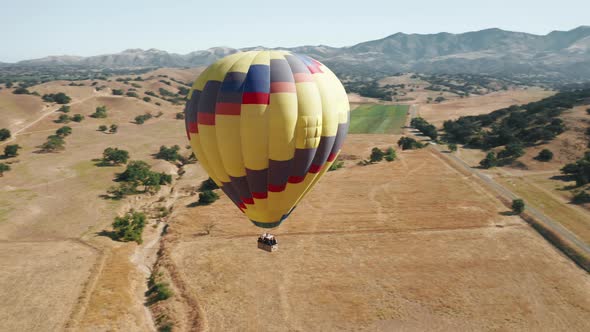 Colorful Hot Air Balloon Epic Flying on Sunny Summer Day Mountains on Background