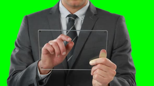 Businessman pretending to use digital tablet