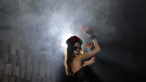 Model with Halloween Makeup Poses in Smoke at Backlight