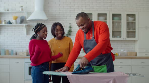 Happy Single Parent Family Enjoying Household Chores