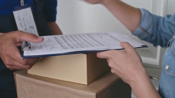 Online Customer Receiving Packages from Delivery Person