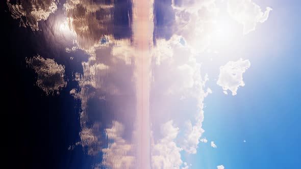 Cloudy Sky Over Calm Water at Sunset Vertical  Looping Background