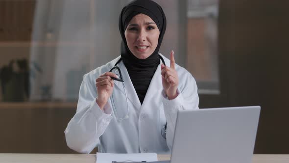 Muslim Annoyed Woman Head Doctor Specialist Indignantly Shouting at Camera Aggressive Having Own