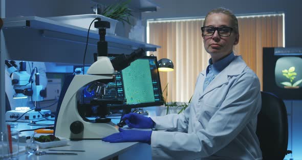 Scientist Using a Microscope in a Lab