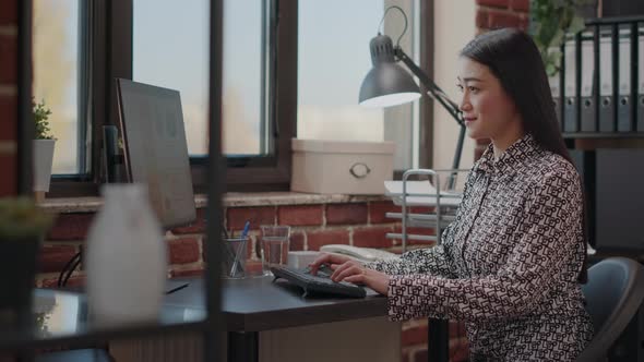 Employee Working on Business Project with Computer