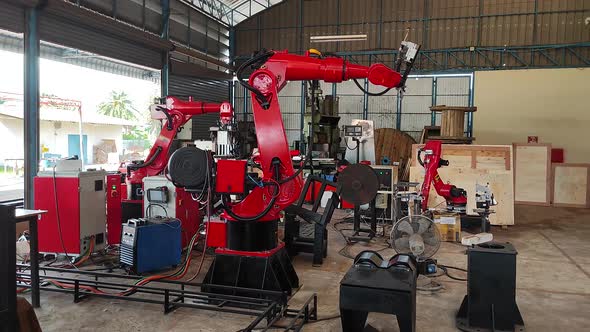 Robot Arm Working, Engineers Maintenance Robot Arm in Robotic line at a manufacturing facility. Robo