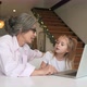 Child and Granny Looking at the Camera with Laptop - VideoHive Item for Sale