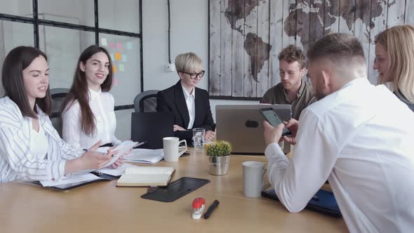 Group of Young People Are Discussing Something in a Modern Office