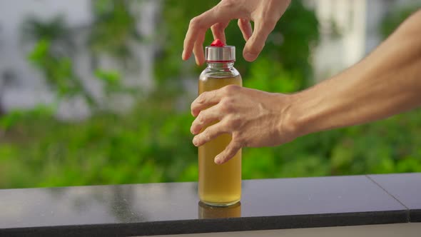 Close Up Shot of a Glass Bottle of a Kombucha Drink