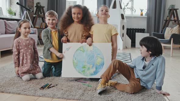 Portrait of Kids with Drawing of Planet Earth
