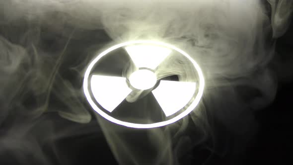 Radiation hazard sign in smoke.